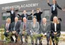 Pupils and staff posed outside their brand new school