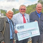 CRSC president Robin Copland (centre) and secretary Eric Schofield (left) hand over the cheque to the Sir Walter Scott Trust CEO James Fraser