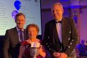 Karen Campbell receiving her award from, left, Chris Baxter, of Harbro and chairman of the Poultry Club of Scotland and, right Kenny Shaw, of Lohmann GB