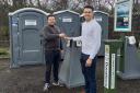 Sam Newell (left) from toilet suppliers Honeywagon is pictured handing over the keys to the temporary toilets sited at Duck Bay Car Park to Darroch Cawley (right) from the Cawley Group