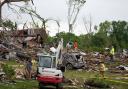 Workers search through the remains of tornado-damaged homes in Greenfield, Iowa (Charlie Neibergall/AP)