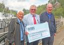 CRSC president Robin Copland (centre) and secretary Eric Schofield (left) hand over the cheque to the Sir Walter Scott Trust CEO James Fraser