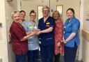 Heather Hodgson presenting SCN Sean Chambers with award and, left to right, team members Student nurse Charlotte McCall, HCSW Rebecca McKie, CSM Margaret O’Rourke and SN Julie Monaghan.