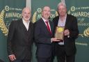 Stuart Cordiner and Fred Moore of Cruise Loch Lomond picking up the award from Stephen Cotter, Chief Operating Officer of CIE Tours