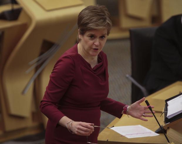 Dumbarton and Vale of Leven Reporter: Nicola Sturgeon addressing MSPs. Credit: PA