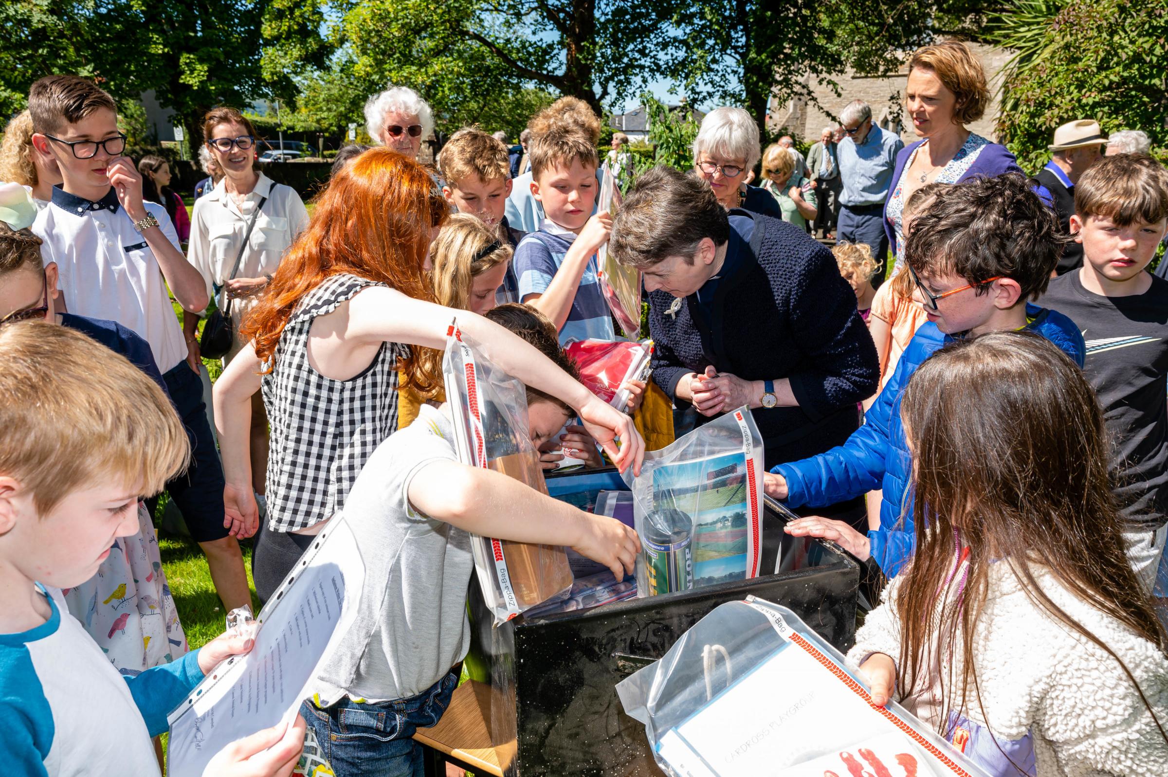 Cardross Millennium Time Capsule Opened. As part of their 150th Anniversary celebrations the time capsule which was buried in the grounds of the church in 2000 was opened. The children of todays church were able to see glimpses of village life 22 years