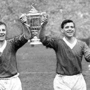 Former Dumbarton manager Davie Wilson, left, has died aged 85 - he is pictured with Rangers team-mate Eric Caldow after the Ibrox club won the Scottish Cup in 1962