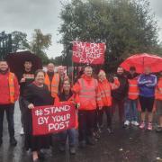 Jackie Baillie MSP on the picket line at Royal Mail's Alexandria sorting office on Friday, September 30 with Kenny Paton, centre, and his colleagues