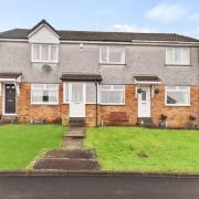 The two-bedroom terraced villa on Hawthorn Avenue in Dumbarton is on the market for offers over £118,500