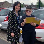 Jennifer Sharkey, pictured supporting OLSP pupil Cian Devlin during an outdoor learning session, scooped the Eco-Coordinator of the Year 2024 Award from a nominee list of more than 30 schools